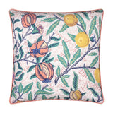 Square polyester cushion with coral piped edge, printed with pomegranates and citrus fruits among green leafy branches on a pale ground, shown on a white background.