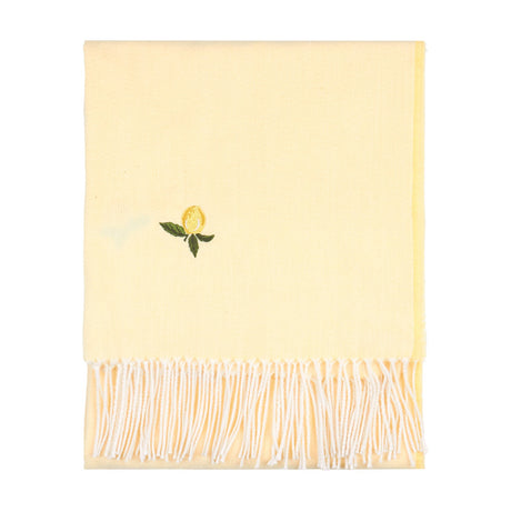 Fruits Knitted Polyester Throw in Zesty Lemon, a folded pale yellow throw with an embroidered lemon motif and white tasselled fringe, shown on a plain white background.