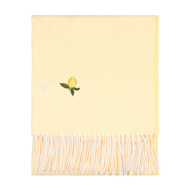 Fruits Knitted Polyester Throw in Zesty Lemon, a folded pale yellow throw with an embroidered lemon motif and white tasselled fringe, shown on a plain white background.