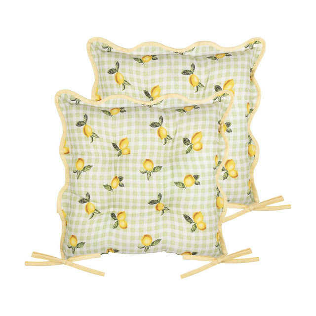 Two square polyester seat pads in sage-and-white gingham with a lemon print, scalloped edges, yellow piping, and fabric ties, shown on a white background.