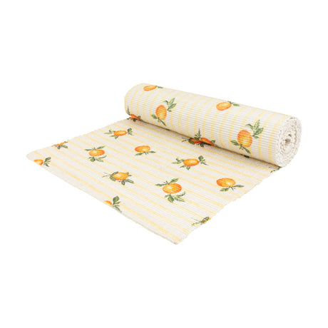 Fruits Striped Polyester Table Runner in yellow, partially rolled to show cream fabric with yellow stripes and a scattered orange citrus print, on a plain white background.