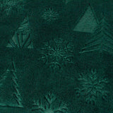 Festive Time Sherpa Woodland Polyester Throw in emerald green, close-up of the soft fleece front with embossed trees and snowflakes in a tonal, low-relief pattern.