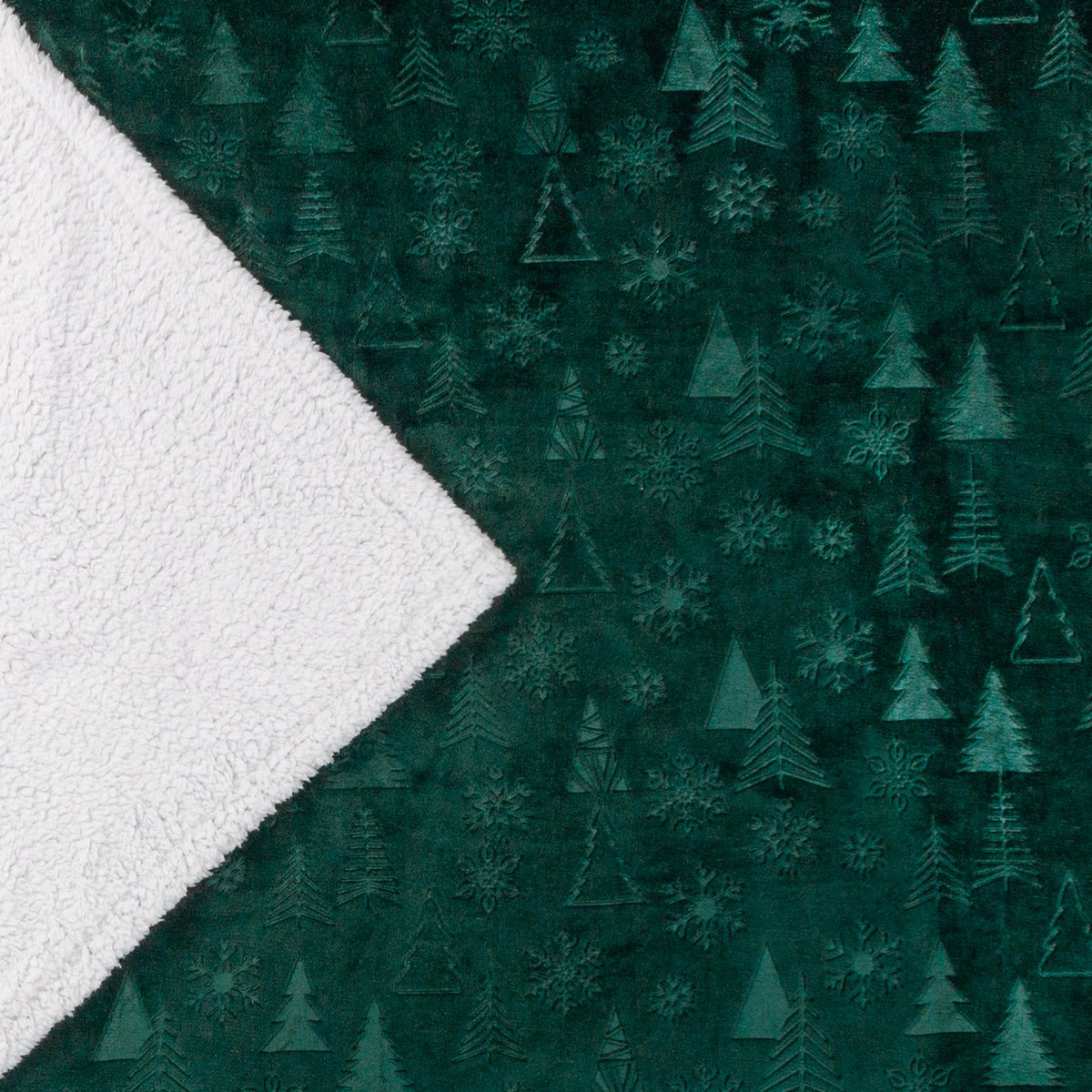 Festive Time Sherpa Woodland Polyester Throw in emerald green, showing the fleece front with embossed tree and snowflake pattern folded back to reveal the white sherpa reverse.