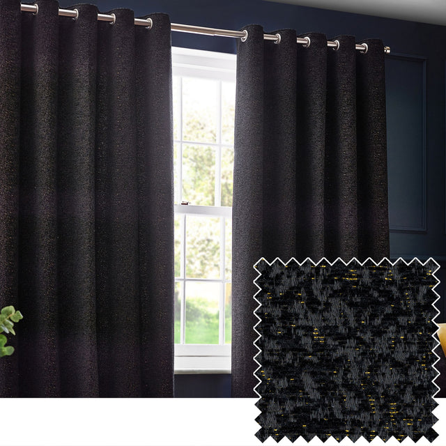 Galaxy Chenille Fully Lined Eyelet Curtains in black hang either side of a window on a metal pole, with a textured chenille fabric swatch showing gold flecks inset below.