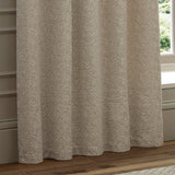 Galaxy Chenille Fully Lined Eyelet Curtains in ivory, shown in soft folds by a window, with a textured yarn-dyed chenille surface and subtle pale flecks.