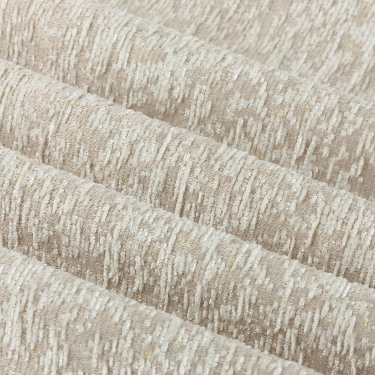 Close-up of Galaxy Chenille Fully Lined Eyelet Curtains in ivory, showing folded fabric with a textured yarn-dyed chenille surface and subtle golden flecks.