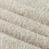 Close-up of Galaxy Chenille Fully Lined Eyelet Curtains in ivory, showing folded fabric with a textured yarn-dyed chenille surface and subtle golden flecks.