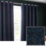 Galaxy Chenille Fully Lined Eyelet Curtains in Navy hung on a rod by a window, with a mottled chenille fabric swatch showing fine gold flecks inset below.