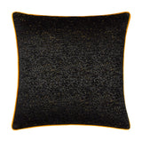 Galaxy Eyelet Chenille Cushion in black, square with textured chenille fabric flecked with gold threads and a contrasting orange piped edge, shown on a plain white background.