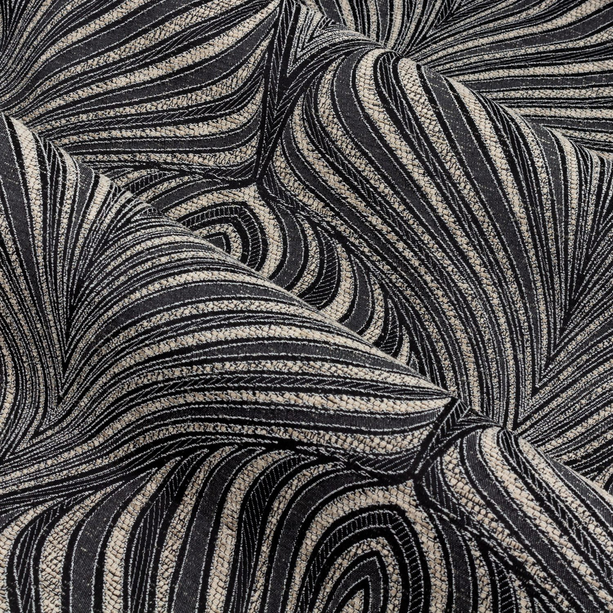 Close-up of Gatsby Jacquard Lined Eyelet Curtains in black, showing a woven feathered arc pattern in champagne and gold tones with a subtle metallic sheen.