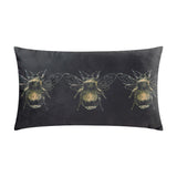 Rectangular black velvet bolster cushion printed with a row of three gold bee designs, shown against a plain white background.