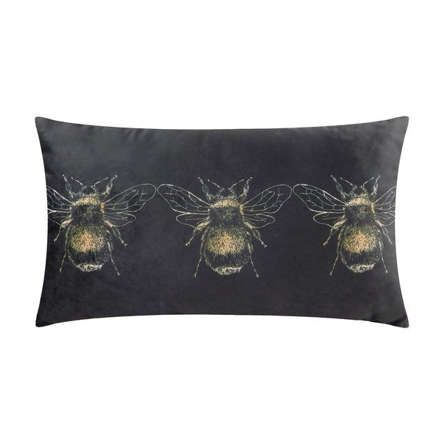 Rectangular black velvet bolster cushion printed with a row of three gold bee designs, shown against a plain white background.