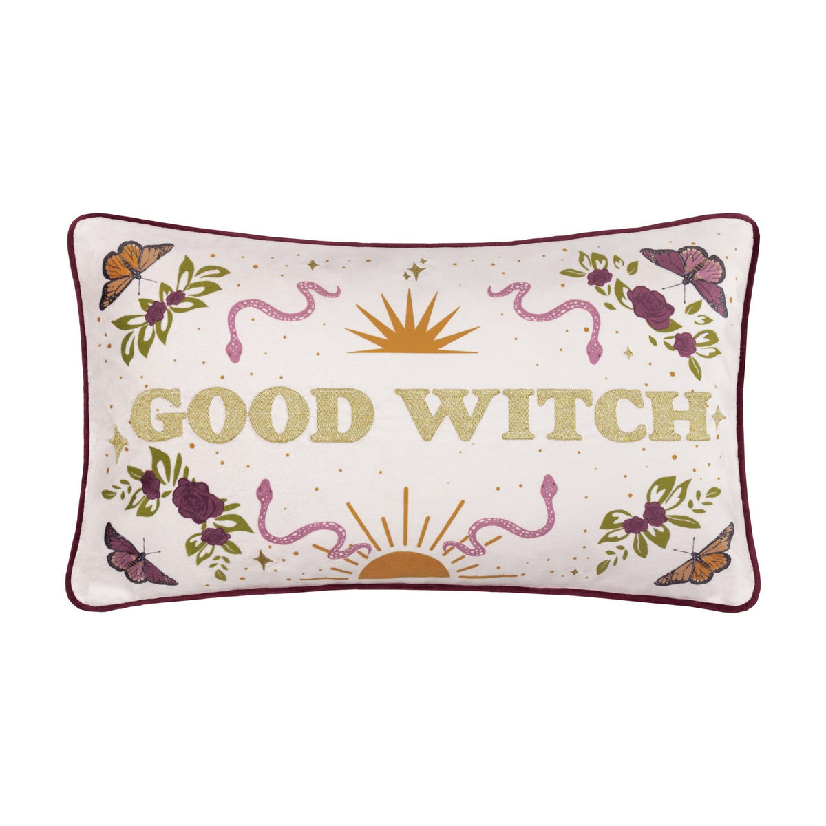Rectangular velvet cushion in cream with gold-embroidered "Good Witch" lettering, bordered by roses, leaves, butterflies, snakes and a sun motif, burgundy piping, shown on a white background.