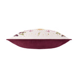 Side view of the Good Witch rectangular velvet cushion, showing cream front with embroidered gold lettering, botanical and snake motifs, and plain burgundy velvet reverse, on a white background.
