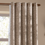 Grace Leaf Jacquard fully lined eyelet curtains in taupe, hung on a wooden pole with metal grommets, showing a woven leaf pattern beside a window.