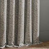 Grace Leaf Jacquard pencil pleat curtains in mist grey, showing draped folds with a woven leaf and stem pattern in a matt satin polyester finish.