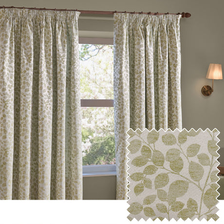 Grace Leaf Jacquard pencil pleat curtains in sage, hanging beside a window with a sage leaf-pattern fabric swatch shown on a plain background.