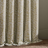 Grace Leaf Jacquard Pencil Pleat Curtains in sage, showing floral vine pattern on cream fabric with pencil pleat heading, draped in a room setting.