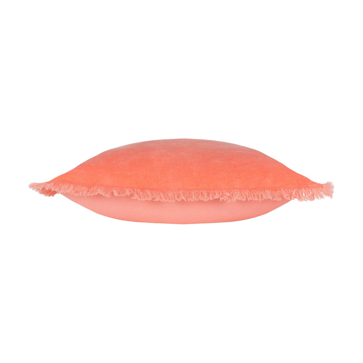 Gracie Velvet Cotton Cushion in coral, shown side-on to reveal its plump square shape and fringed trim edging, set against a plain white background.