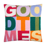 Square tufted polyester cushion spelling "GOOD TIMES" in bold block letters across a multicoloured patchwork of pink, green, orange, blue and yellow panels, shown on a white background.