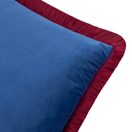 Close-up of the Halo Fringed Velvet Cushion showing plain navy velvet face with burgundy fringed trim along the edge, on a white background.