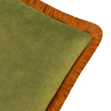Close-up of the Halo Fringed Velvet Cushion in olive green velvet with a contrasting ginger fringe trim along all edges, shown on a plain white background.