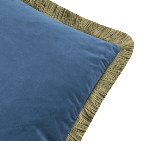 Close-up of the Halo Fringed Velvet Cushion in petrol blue, showing the plain velvet face and sage fringed trim along the edge on a white background.