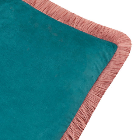 Close-up of the Halo Fringed Velvet Cushion in teal, showing the plain velvet face and blush pink fringe trim along the edge on a white background.