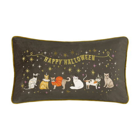 Rectangular grey velvet cushion with gold piping, featuring embroidered Halloween-costumed cats and "Happy Halloween" gold lettering amid star details, on a plain white background.
