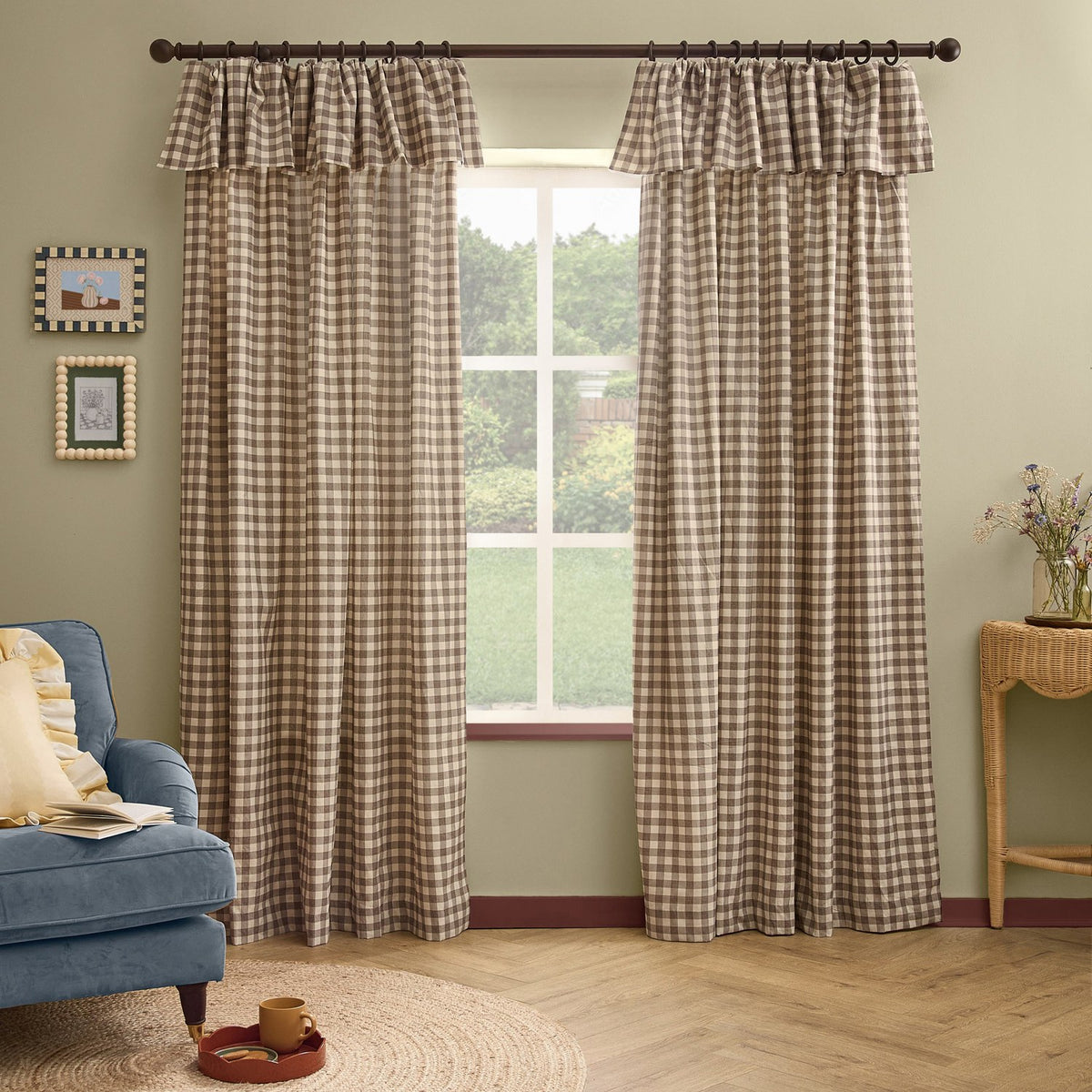 Harriet Gingham cotton pencil pleat curtains in buttermilk and chocolate check with ruffled header, hung on a bronze rod in a living room beside a window.