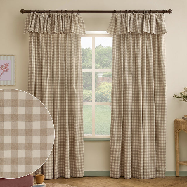 Harriet Gingham Cotton Pencil Pleat Curtains in natural beige and cream checked print, with ruffled flop-top valance headers, shown hanging in a living room window.