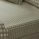 Harriet Gingham Check Cotton Fitted Sheet in Baygreen/Mist, showing the sage-and-cream check pattern and textured cotton weave fitted over a mattress corner.