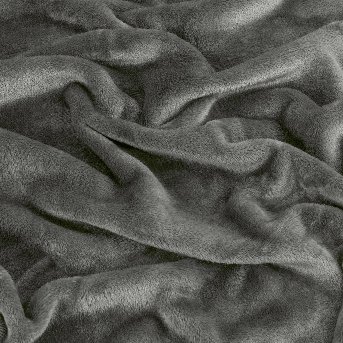 Close-up of the Harrow Plain Polyester Throw in charcoal, showing the dense, brushed flannel fleece pile in soft matt grey with folds and no visible pattern.