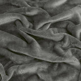 Close-up of the Harrow Plain Polyester Throw in charcoal, showing the dense, brushed flannel fleece pile in soft matt grey with folds and no visible pattern.
