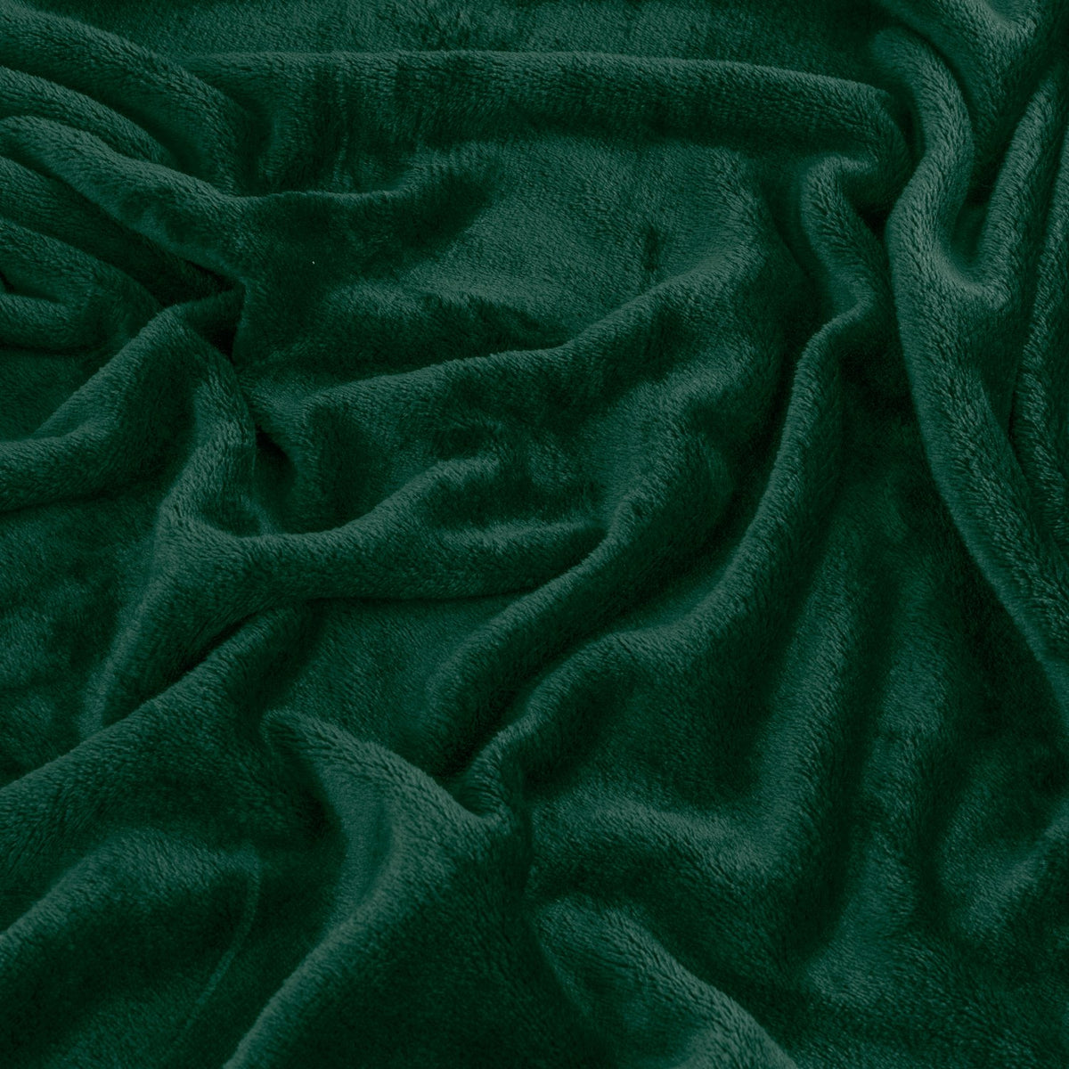 Close-up of the Harrow Plain Polyester Throw in emerald green, showing its dense, short flannel fleece pile with soft folds and no border or pattern.
