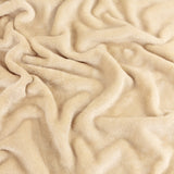 Close-up of the Harrow Plain Polyester Throw in natural cream, showing its soft, dense flannel fleece pile draped in folds.