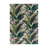 Hawaii Floral Polyester Rug in green, digitally printed with layered banana and palm leaves, pink stems and yellow blooms on a white ground, shown flat on a plain background.