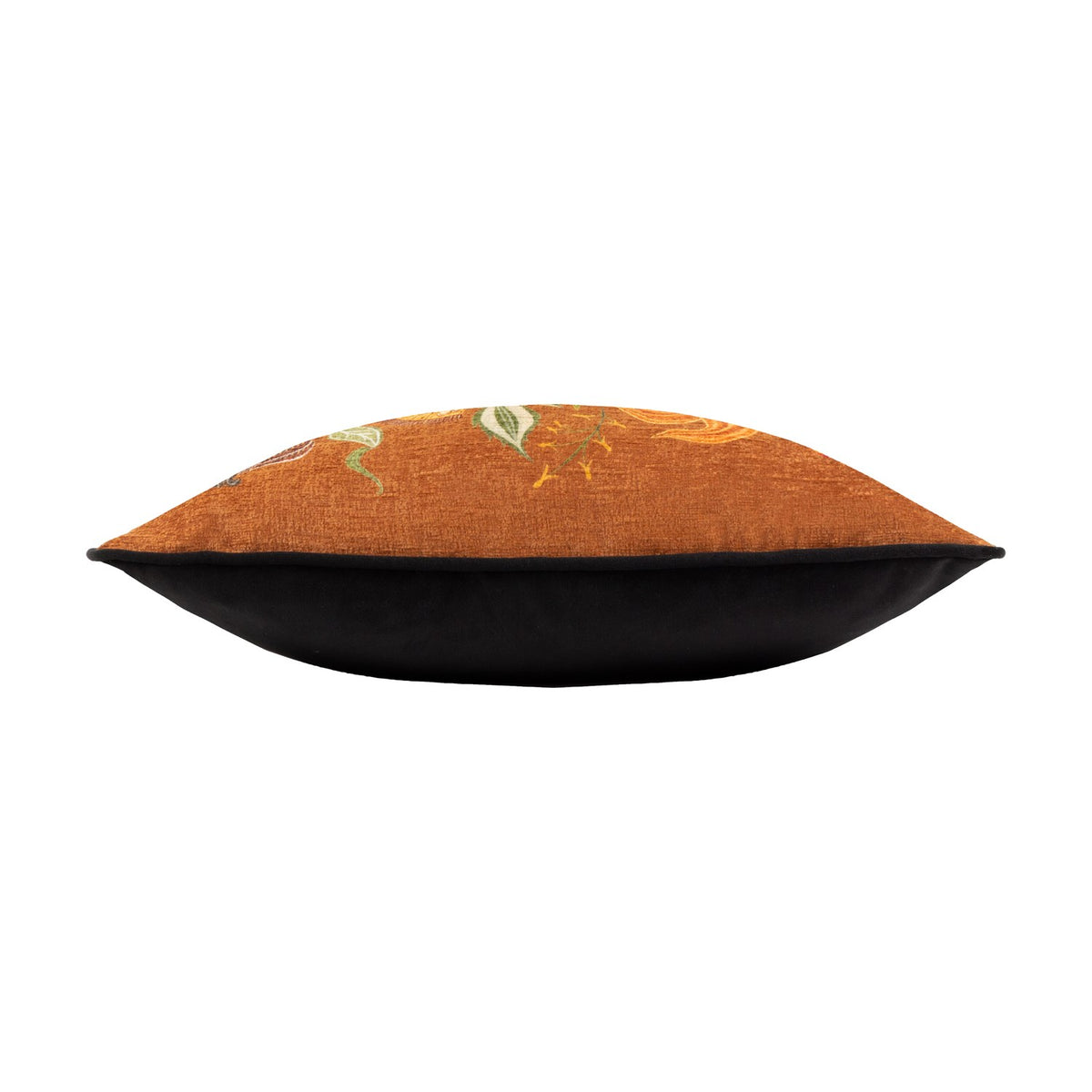 Side view of the Hawthorn printed velvet chenille cushion in ginger, showing floral chenille fabric on one side and plain black velvet on the reverse, set against a white background.