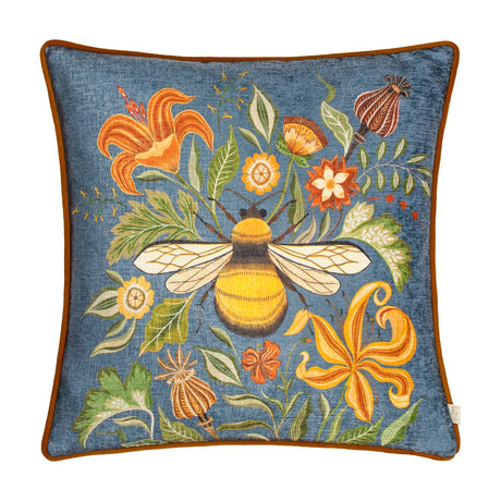 Square petrol blue chenille cushion with a printed bumblebee and woodland florals in orange, gold and rust, finished with rust-coloured piping, on a white background.