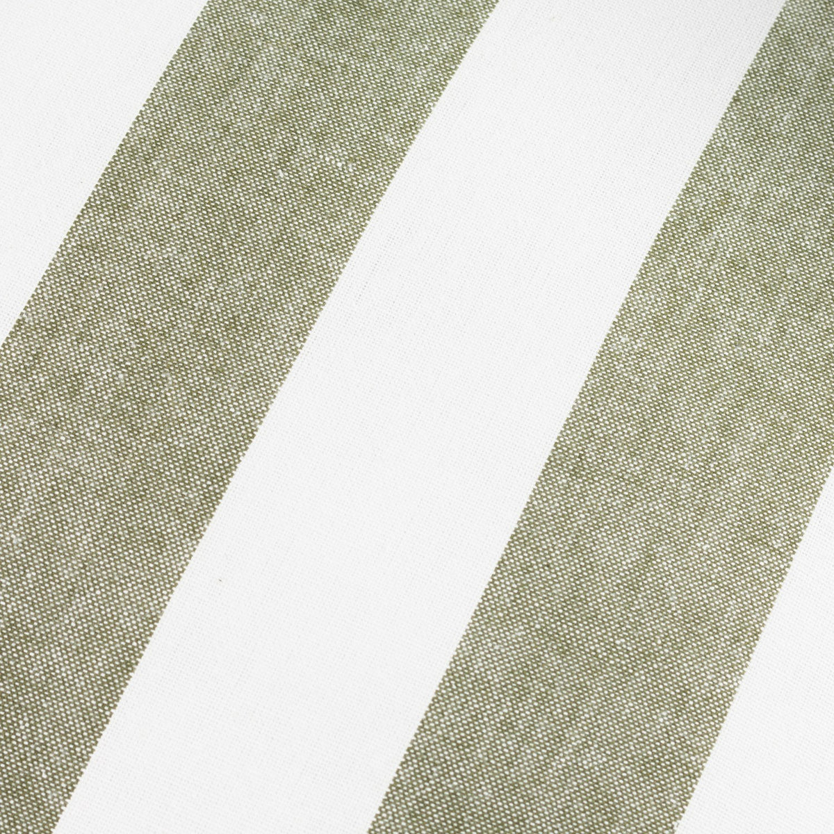 Close-up of the Hayle Reversible Cotton Cushion in Lichen, showing wide diagonal green stripes on a white cotton ground.
