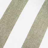Close-up of the Hayle Reversible Cotton Cushion in Lichen, showing wide diagonal green stripes on a white cotton ground.