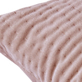 Close-up of the Haze Plain Velvet Cushion in coral, showing a quilted wave-stitched velvet surface in soft ridges on a plain background.
