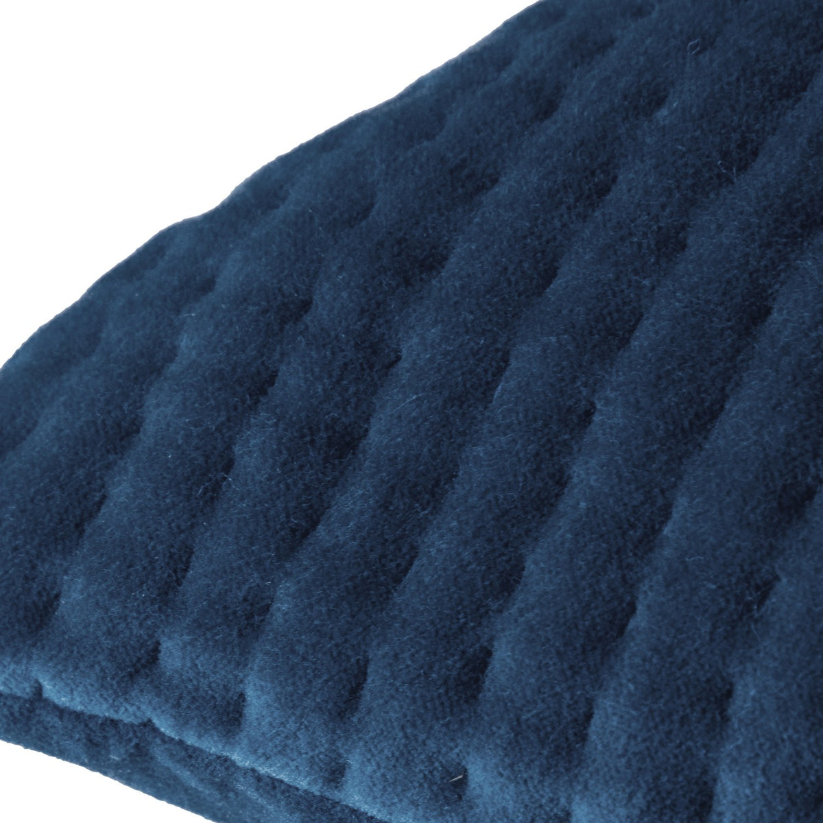 Close-up of the Haze Plain Velvet Cushion in Bluebelle, showing quilted velvet fabric with fine parallel ridges in deep navy-blue, against a white background.