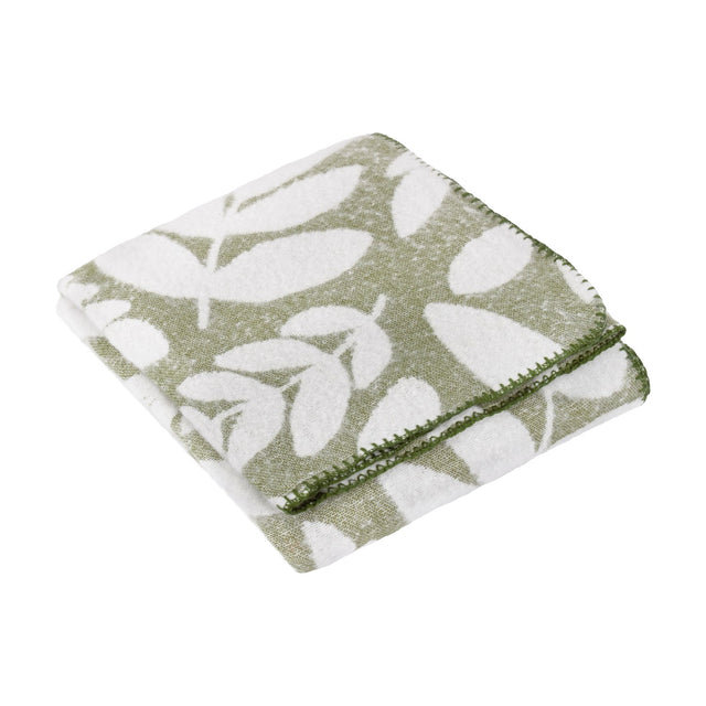 Hazel Botanical Polyester Throw in olive green, folded showing a white leaf pattern with a green whip-stitched edge, on a plain white background.