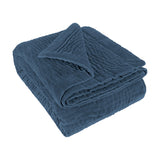 Haze Velvet Cotton Throw in Bluebell blue, folded to show quilted velvet texture with visible stitching rows, on a plain white background.