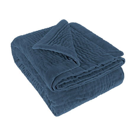 Haze Velvet Cotton Throw in Bluebell blue, folded to show quilted velvet texture with visible stitching rows, on a plain white background.