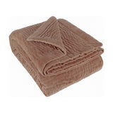 Haze Velvet Cotton Throw in coral, folded to show hand-quilted stitched texture and soft velvet finish, on a plain white background.