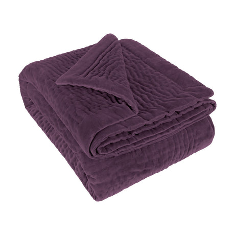 Haze Velvet Cotton Throw in Plum, folded to show hand-quilted rippled texture on a soft velvet finish, set against a plain white background.