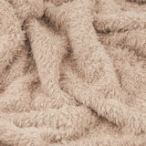 Close-up of the Harlan Borg Sherpa Plain Polyester Throw in natural beige, showing the deep, textured borg pile fabric folded and rumpled.