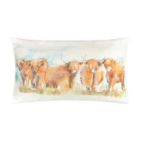 Rectangular linen-cotton cushion in Russet featuring a hand-painted watercolour row of highland cattle in russet and amber tones against a pale blue and cream sky, shown on a plain white background.